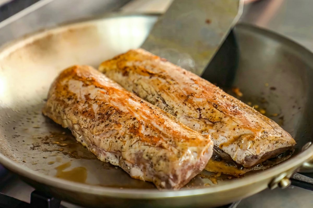 Beef fillet with spices on a hot frying pan. Homemade roasted beef, serving food for restaurant, men