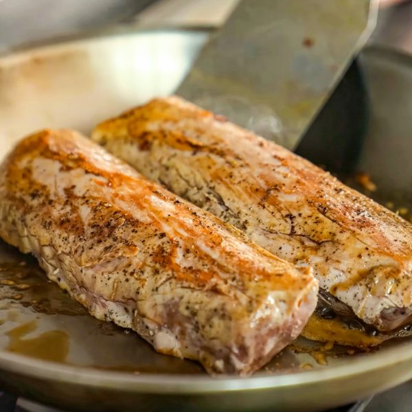 Beef fillet with spices on a hot frying pan. Homemade roasted beef, serving food for restaurant, men