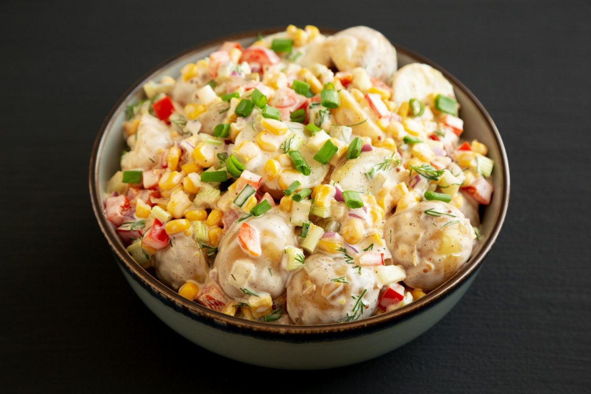 Homemade Summer Potato Salad in a Bowl, side view.