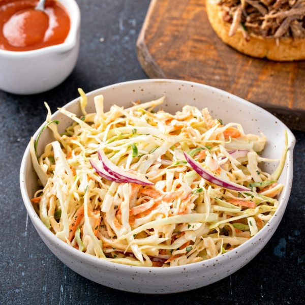 Traditional cole slaw salad, side dish for pulled pork sandwich